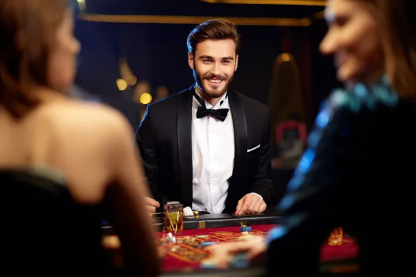 SLO16 Live Games — Take part in high-energy casino action A glowing roulette wheel with cascading chips, symbolizing the engaging live and instant-win games available on SLO16.
